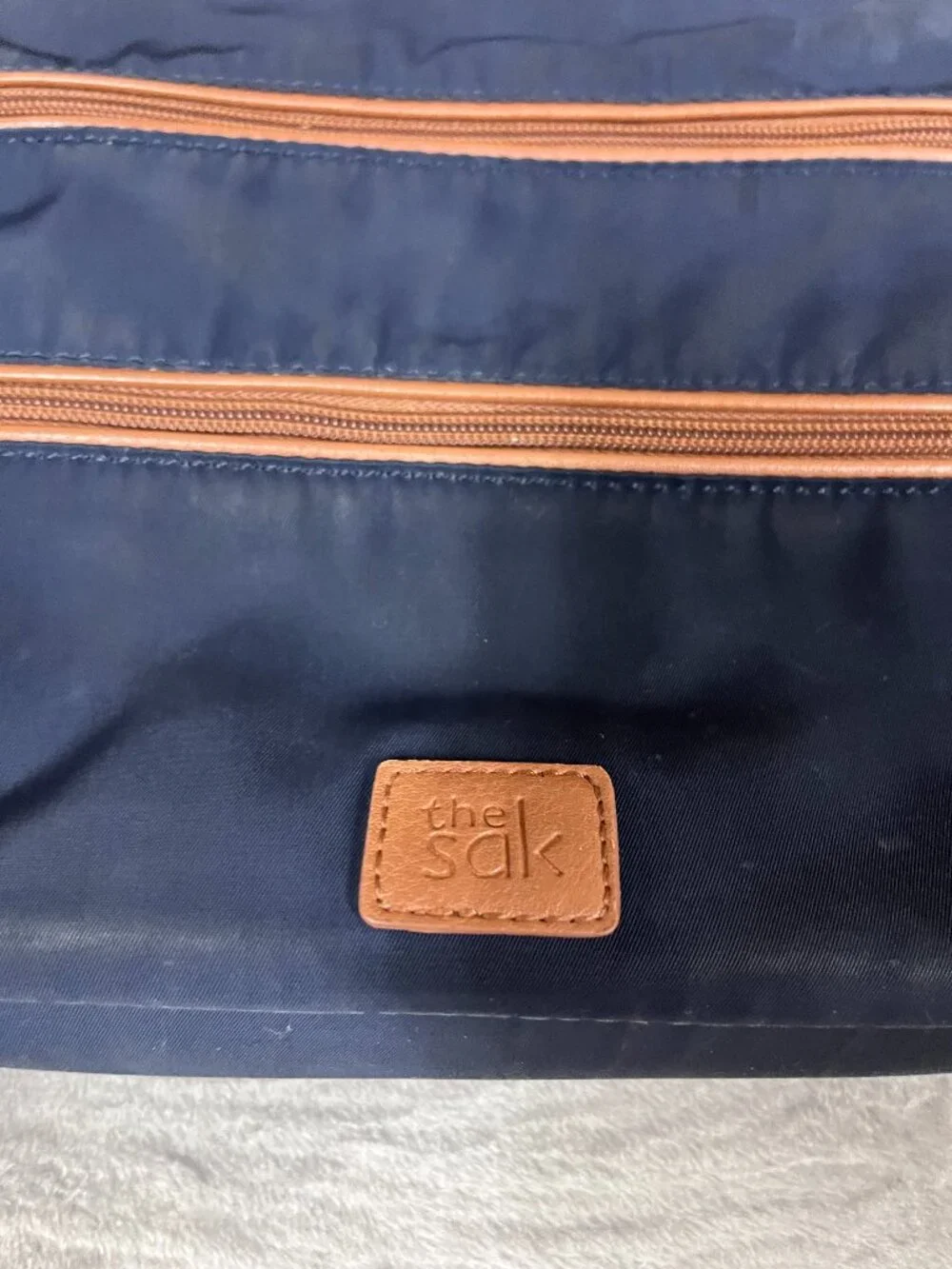 The Sak Navy Nylon Crossbody Bag with Brown Accents